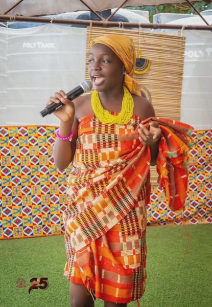 A Gracedew pupil in traditional headwrap and beads on Cultural Day