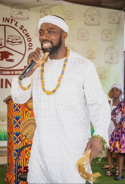 A Gracedew pupil in traditional dress performing on Cultural Day