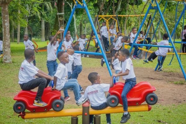 Gracedew pupils on the playground swings during an excursion