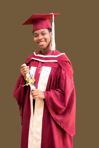 A Gracedew graduate smiling in cap and gown